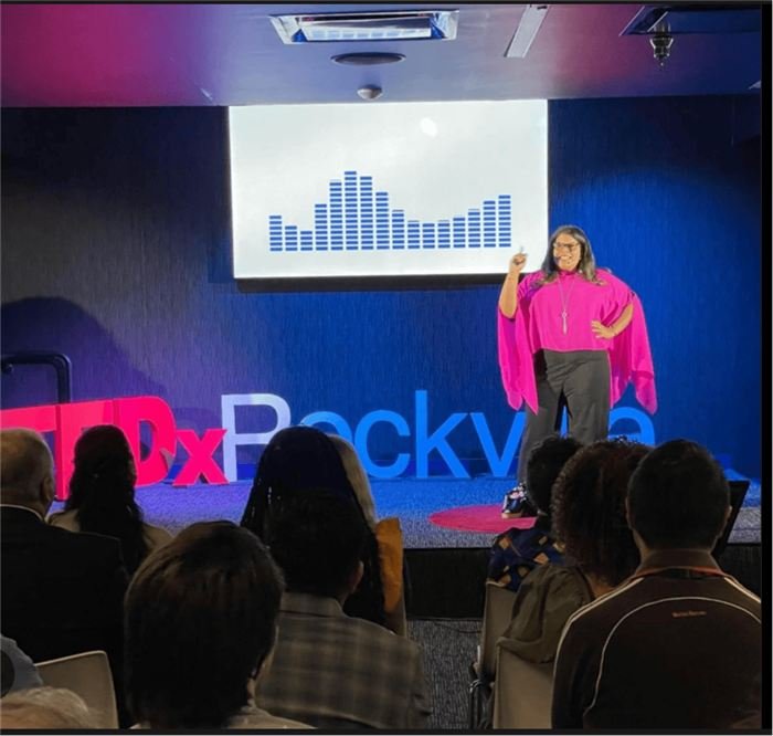 Alicia Lyttle presenting on stage at TEDxRockville